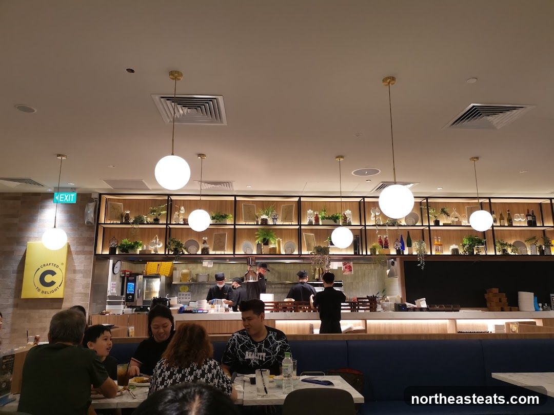 Restaurant Interior with Diners and Open Kitchen
