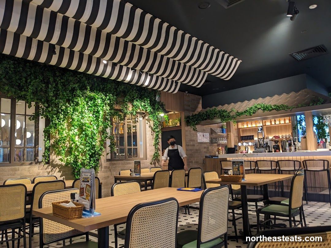 Restaurant Interior with Greenery and Bar