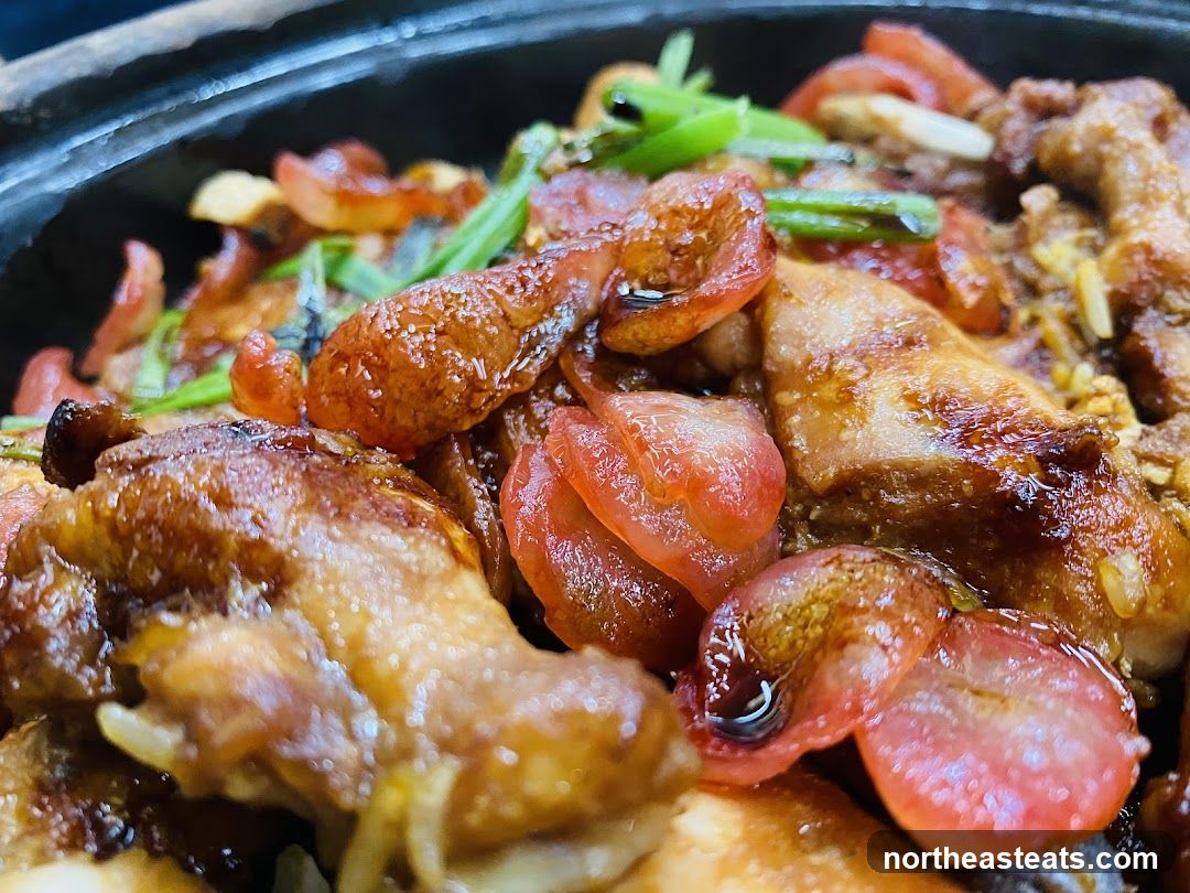 Close-up of a savory dish with meat and vegetables.