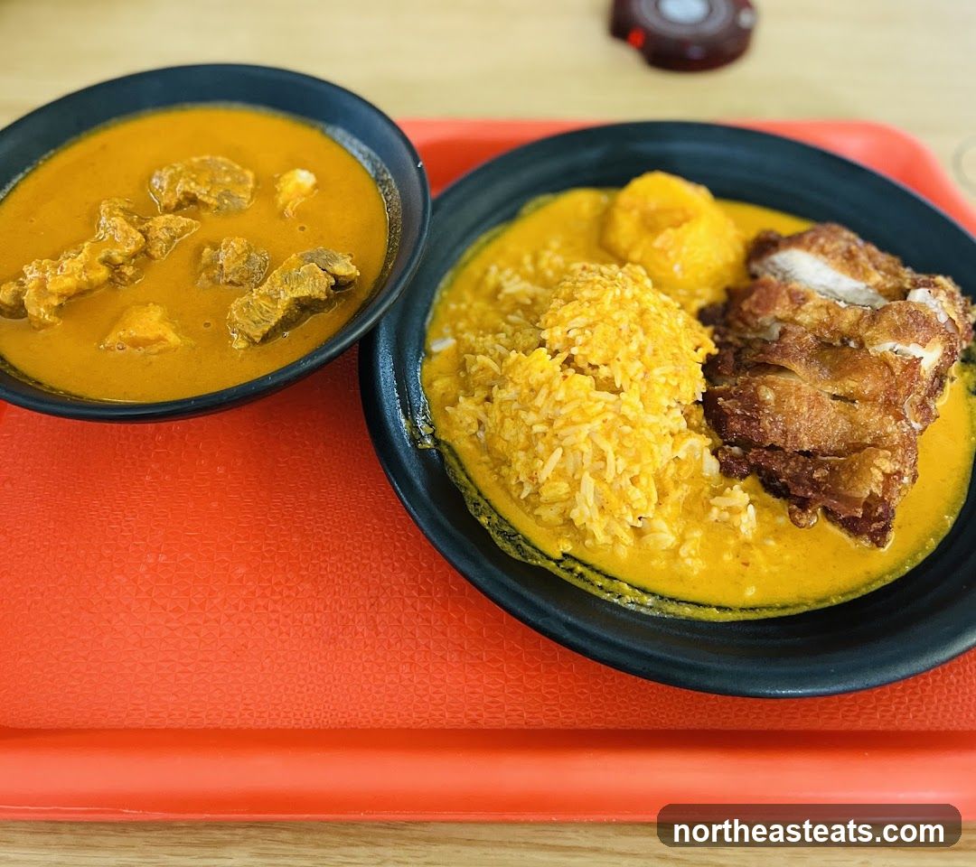 Curry dishes with rice and fried chicken