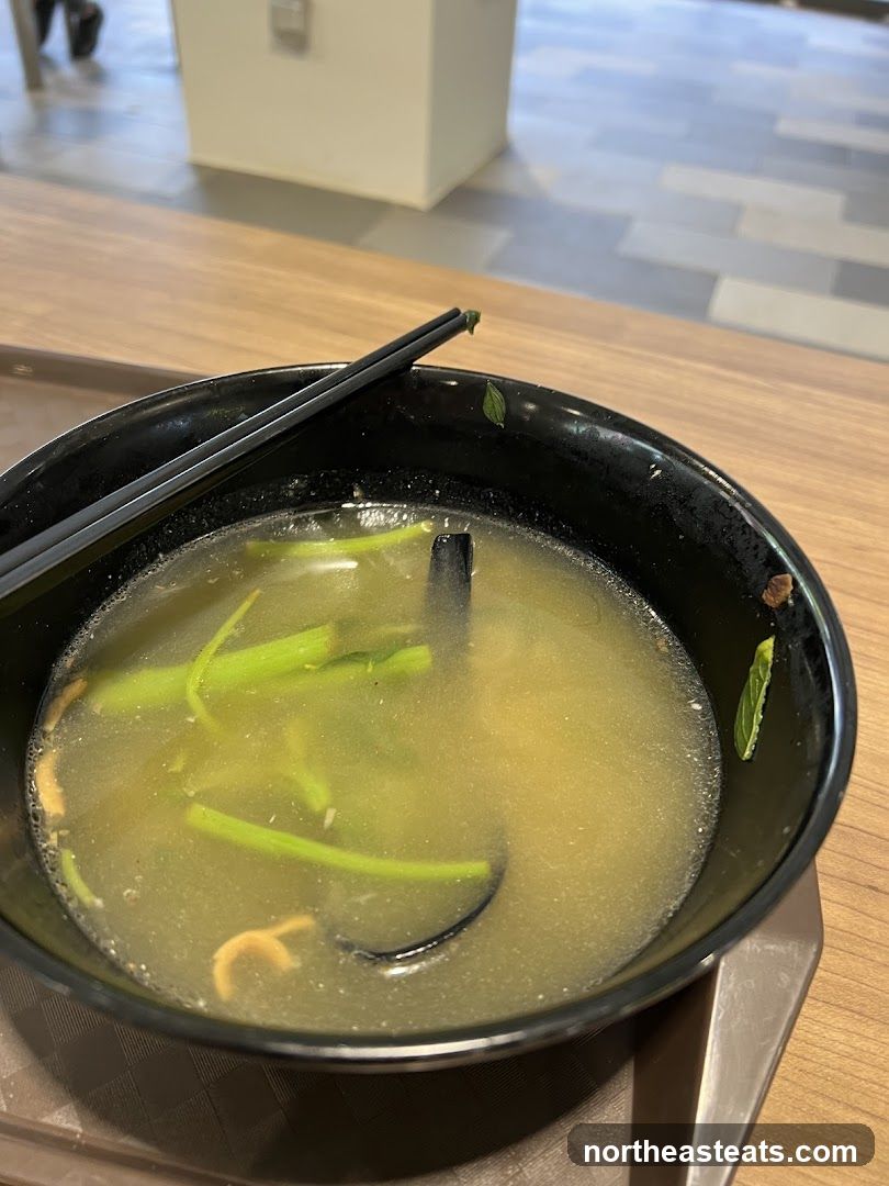 Bowl of Soup with Chopsticks