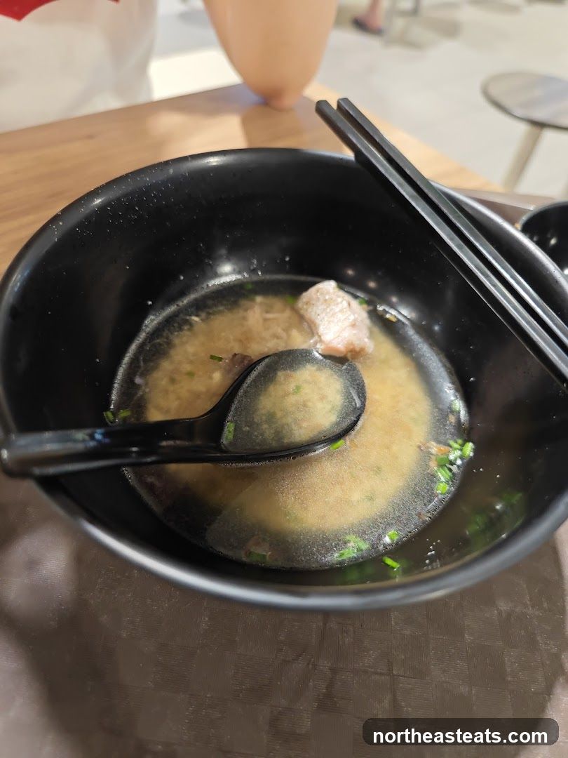 Bowl of Soup with Chopsticks