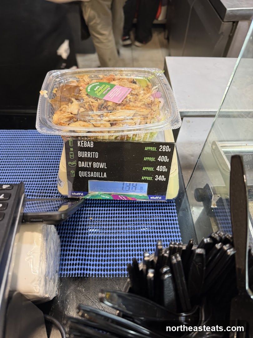 Food container on scale with menu