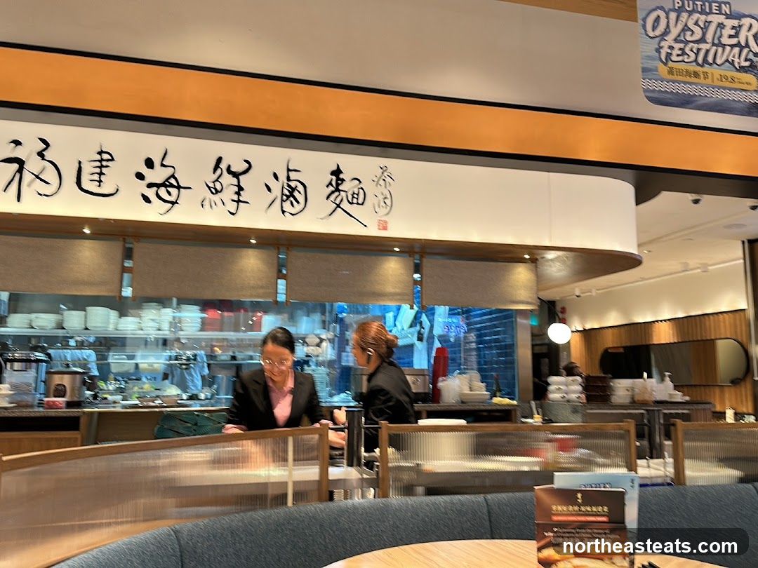 Restaurant Interior with Staff and Signage