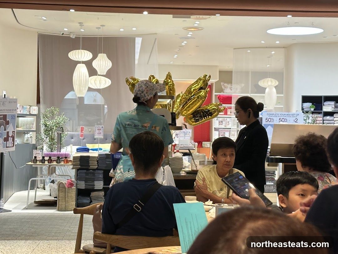 Store Interior with Customers and Staff