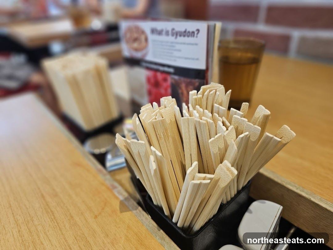 Chopsticks and informational card on a table