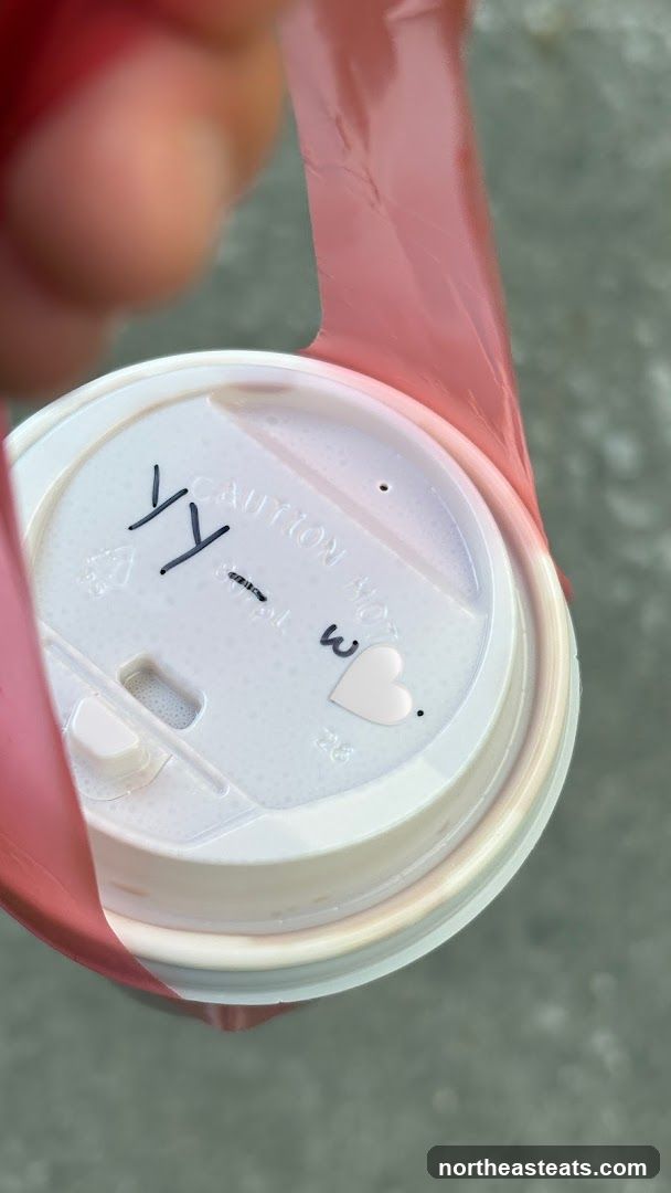 Coffee cup lid with drawing