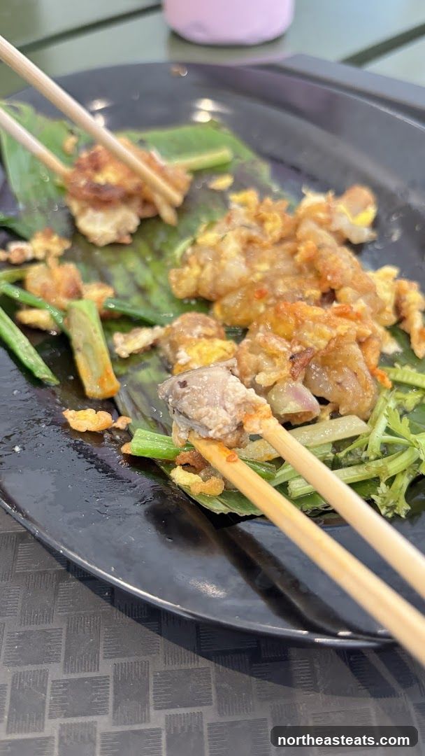 Oyster omelet with chopsticks