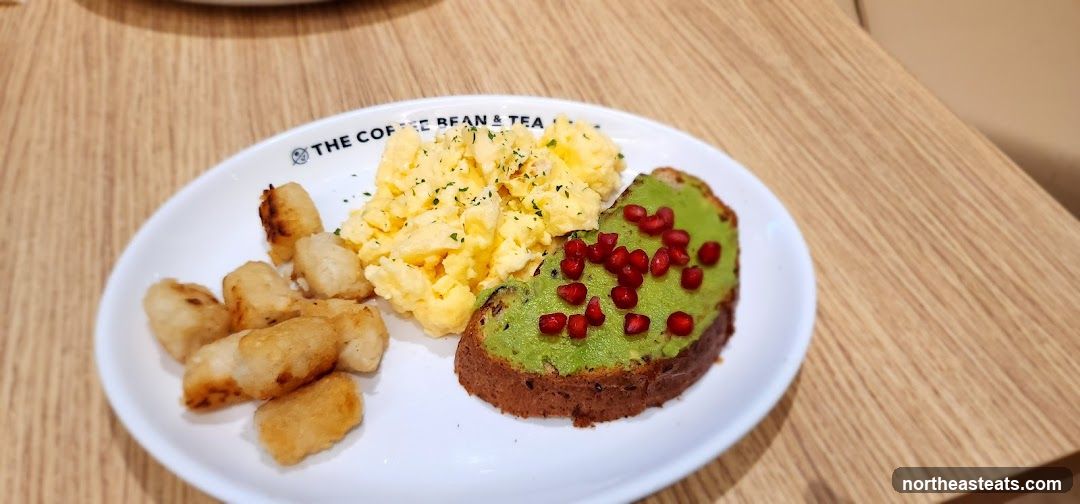 Avocado toast with scrambled eggs and tater tots