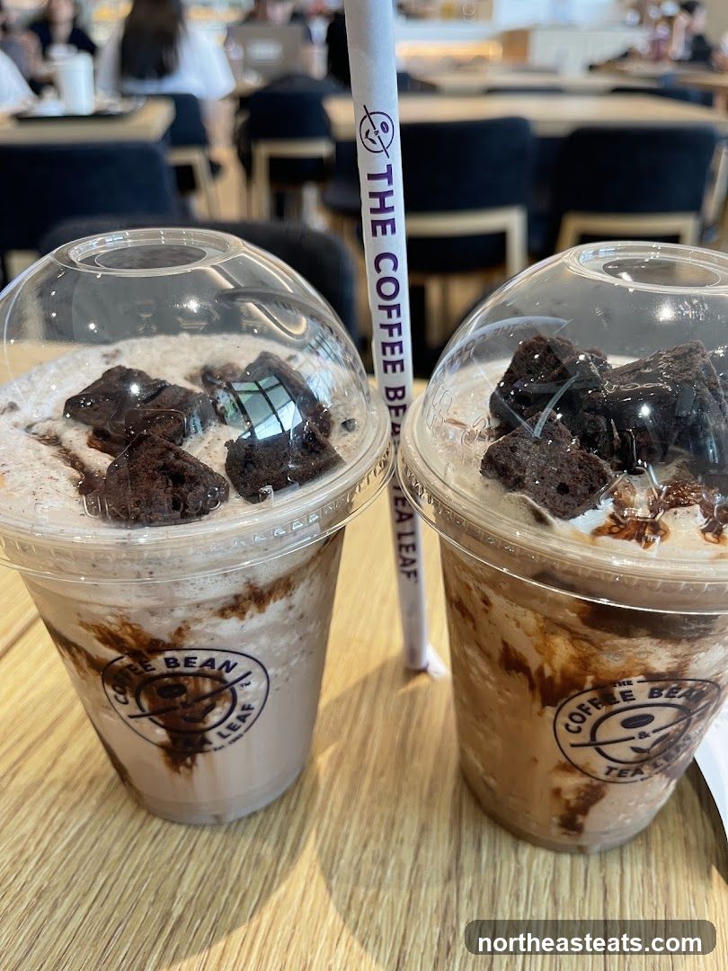 Two iced coffee drinks with brownies