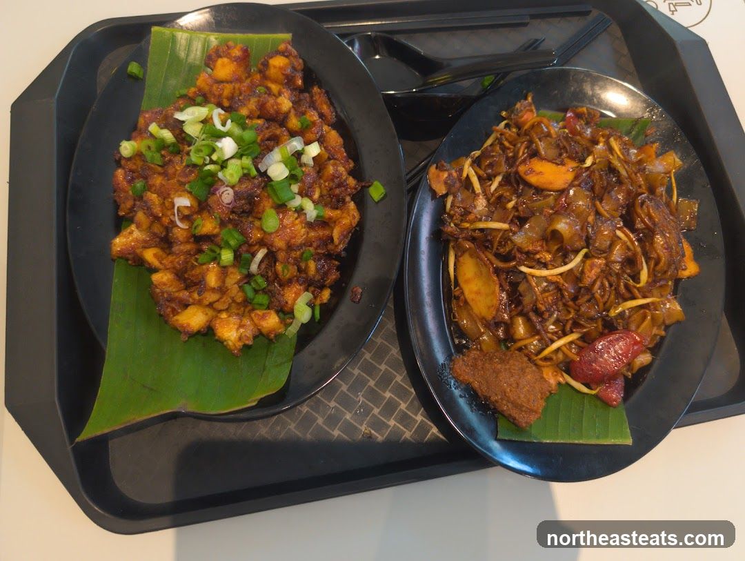 Two plates of food on a tray