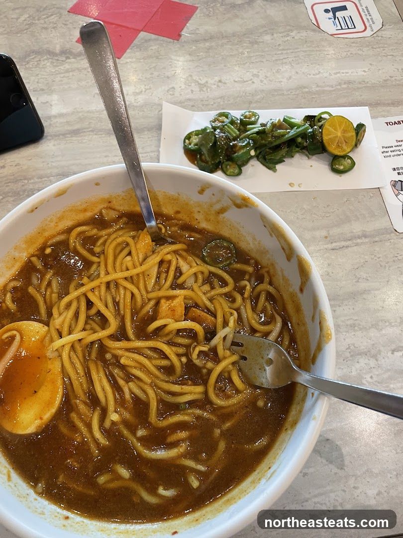 Noodle Dish with Side of Chili and Lime