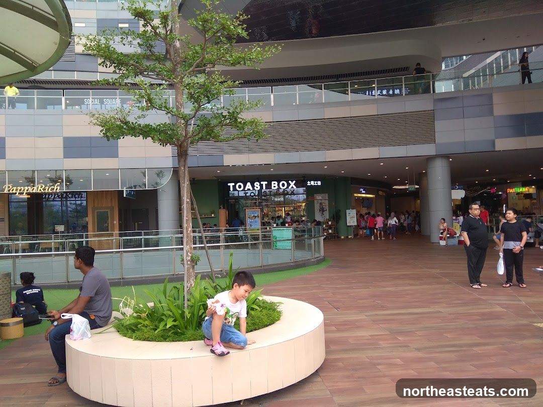 Outdoor seating area with shops