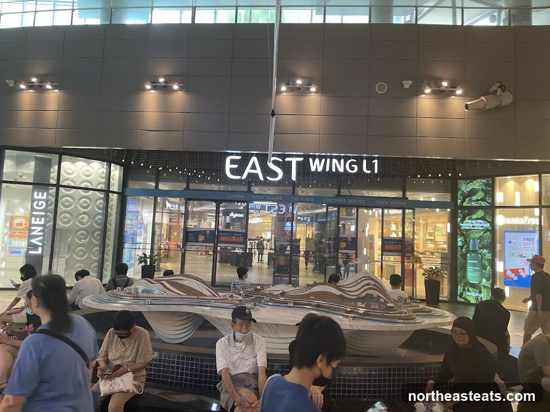 Mall Interior with Shops and People