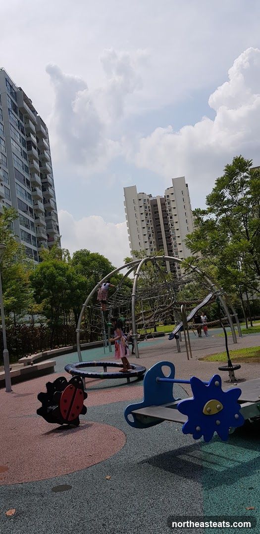 Playground with apartment buildings in the background