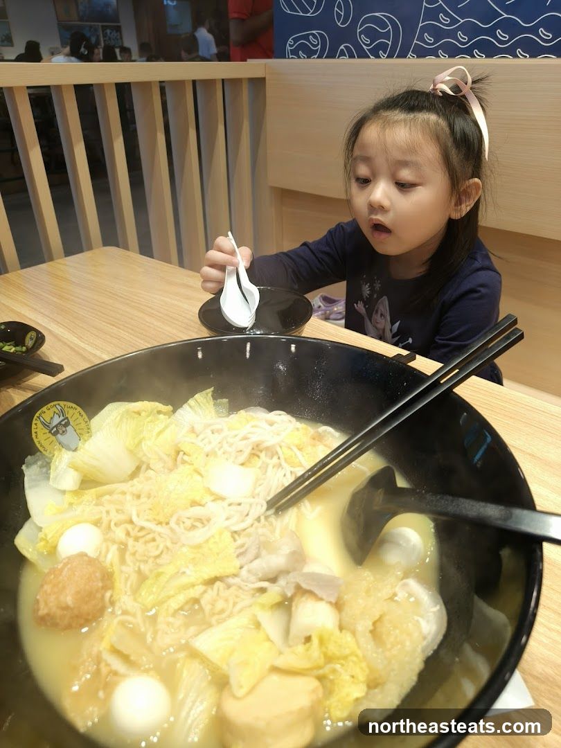 Girl Eating Hot Pot