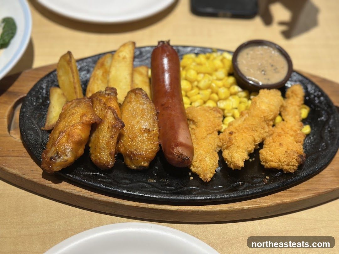 Sizzling Platter with Chicken Wings, Sausage, and Fries