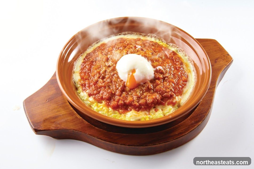 Steaming Savory Dish with Poached Egg