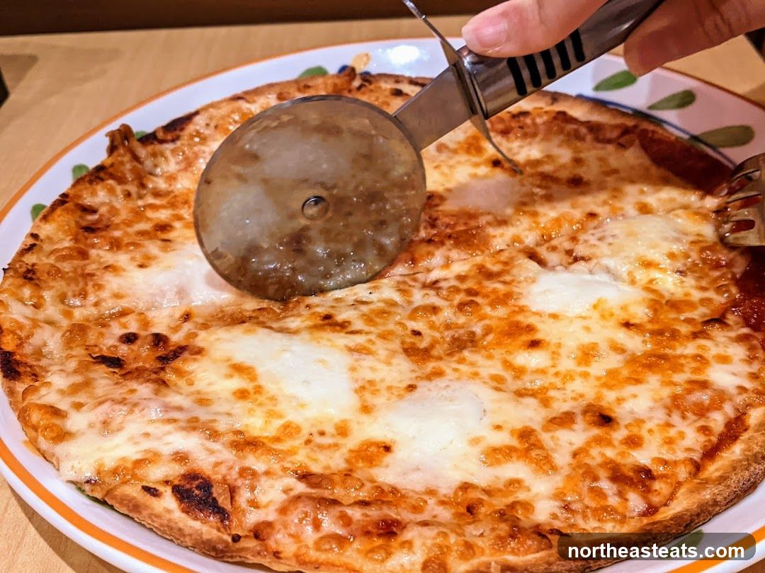 Pizza being cut