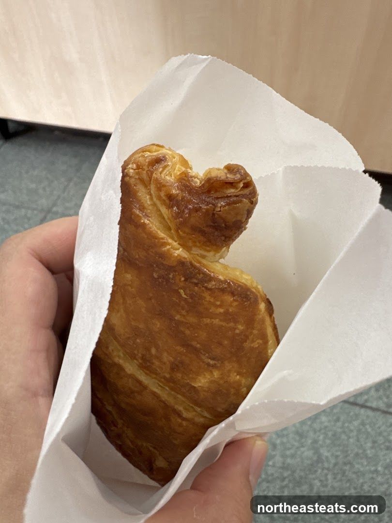 Croissant in a paper bag
