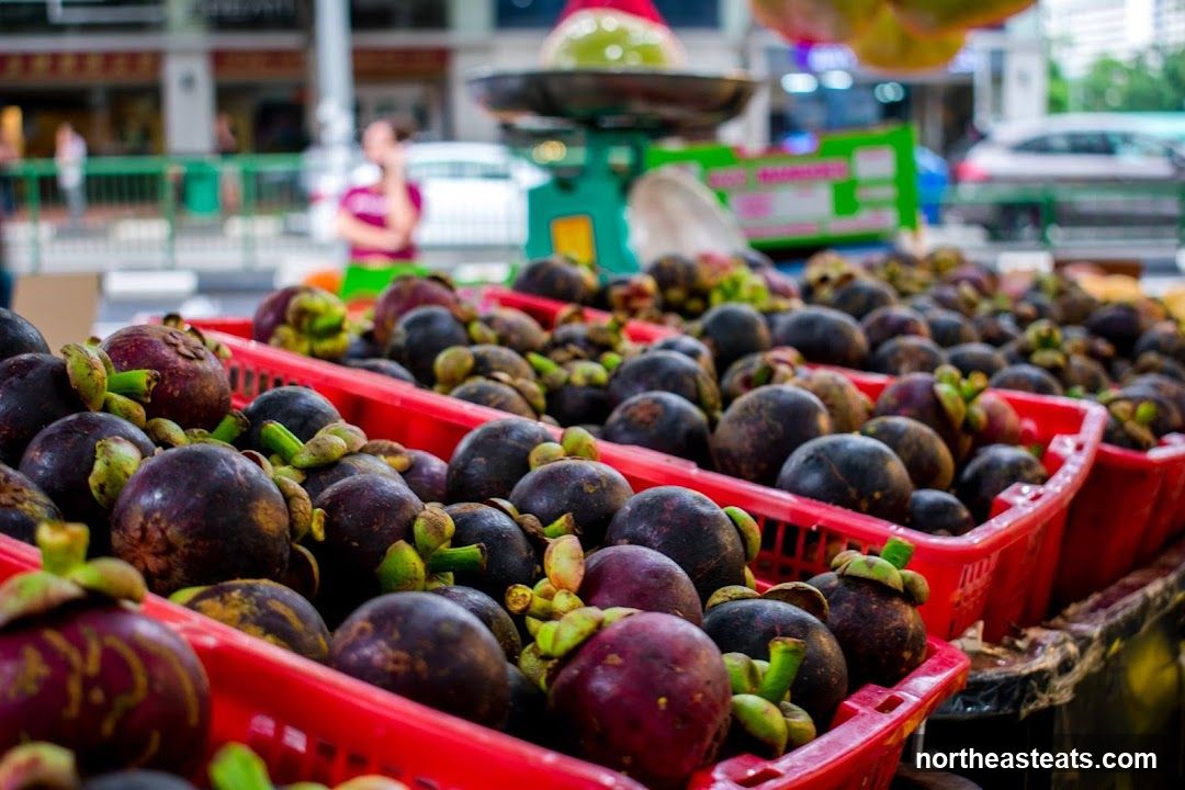 Mangosteens at a Market Stall