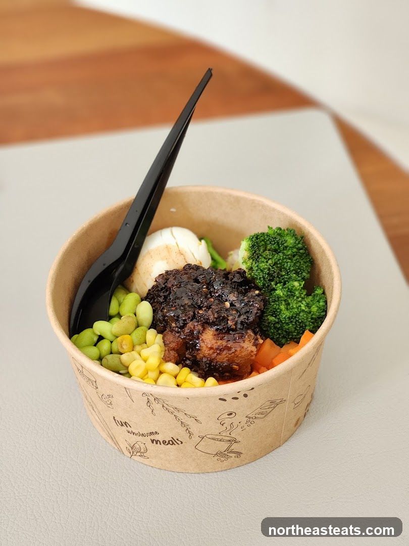 Bowl of food with vegetables and protein