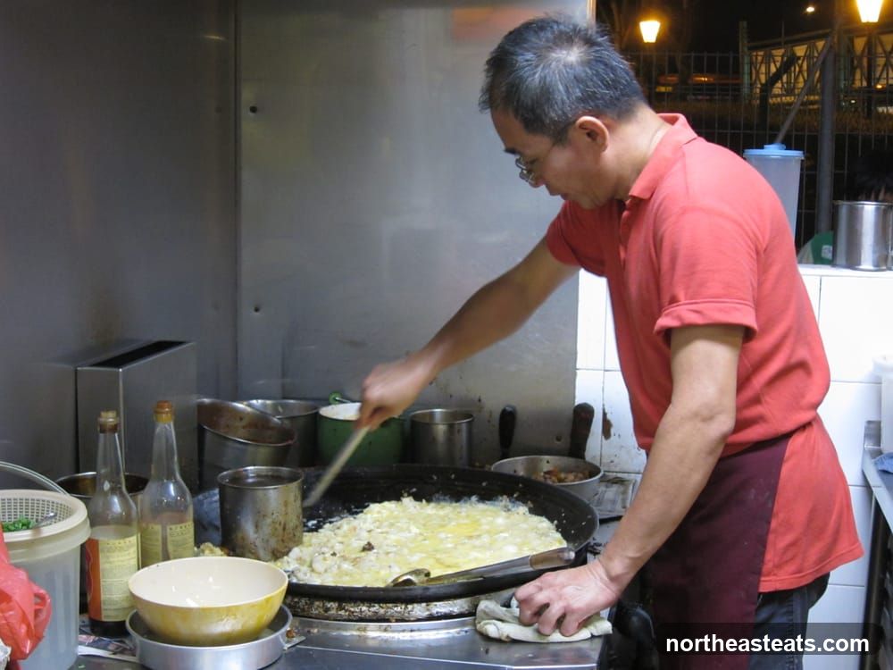 Man cooking at a food stall