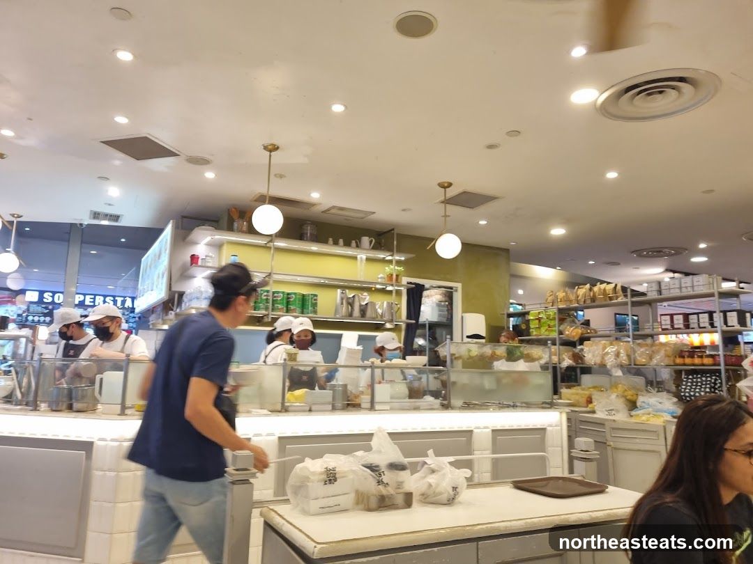 Inside a cafe with staff preparing food