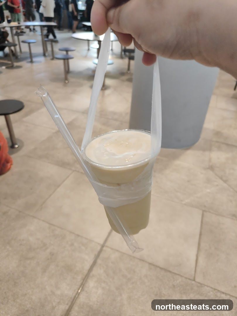 Beverage in a Plastic Cup with Straws