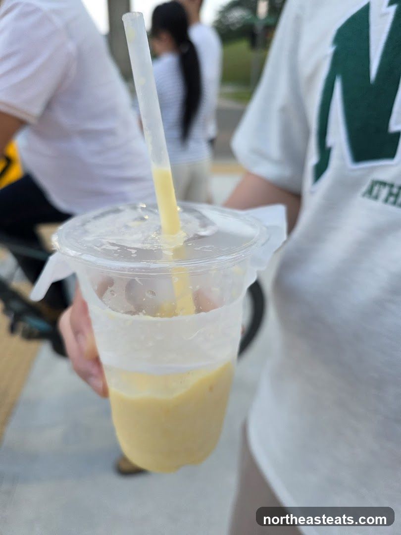 Yellow Drink in a Plastic Cup