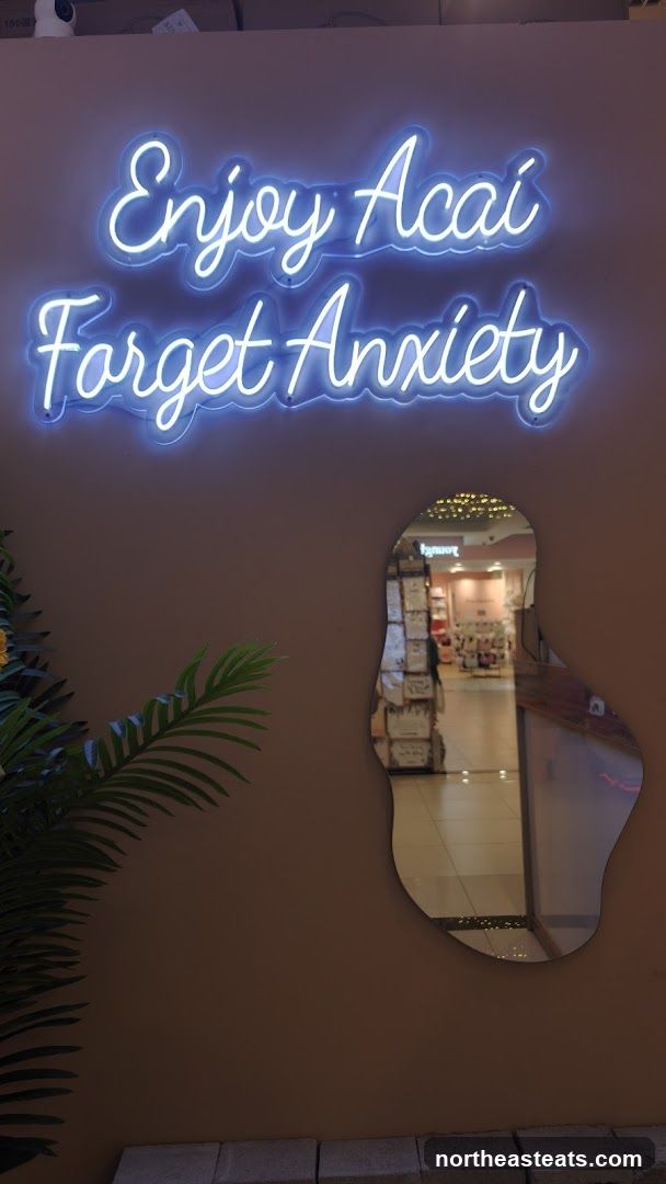 Neon sign with acai and anxiety quote