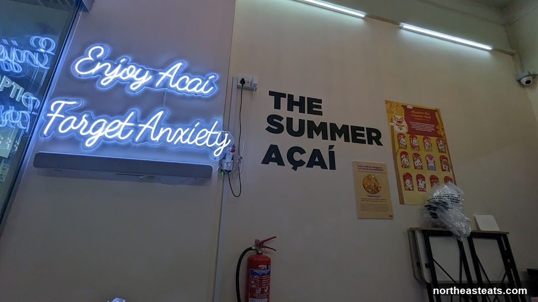 Neon Sign and Açaí Bowl Advertisement