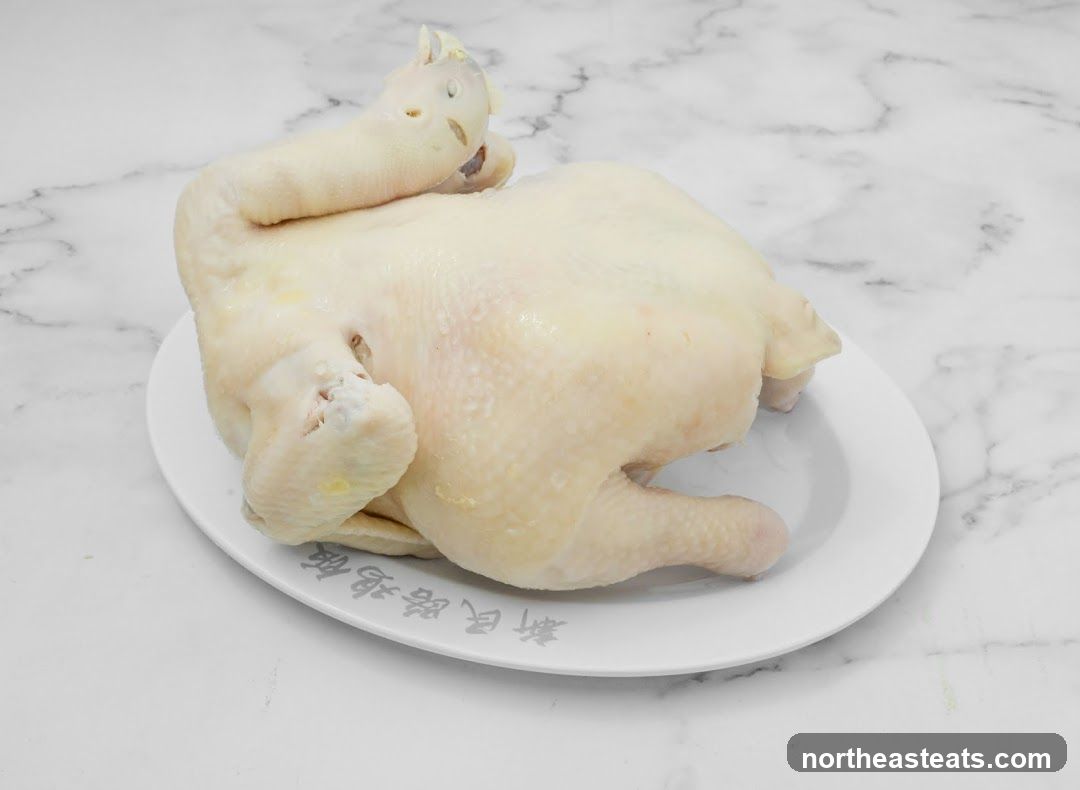 Whole Raw Chicken on a Plate