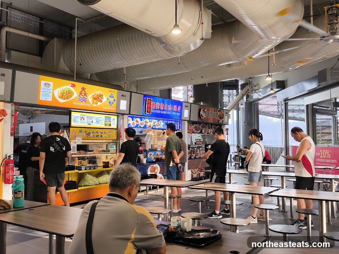 Food court with various stalls and diners