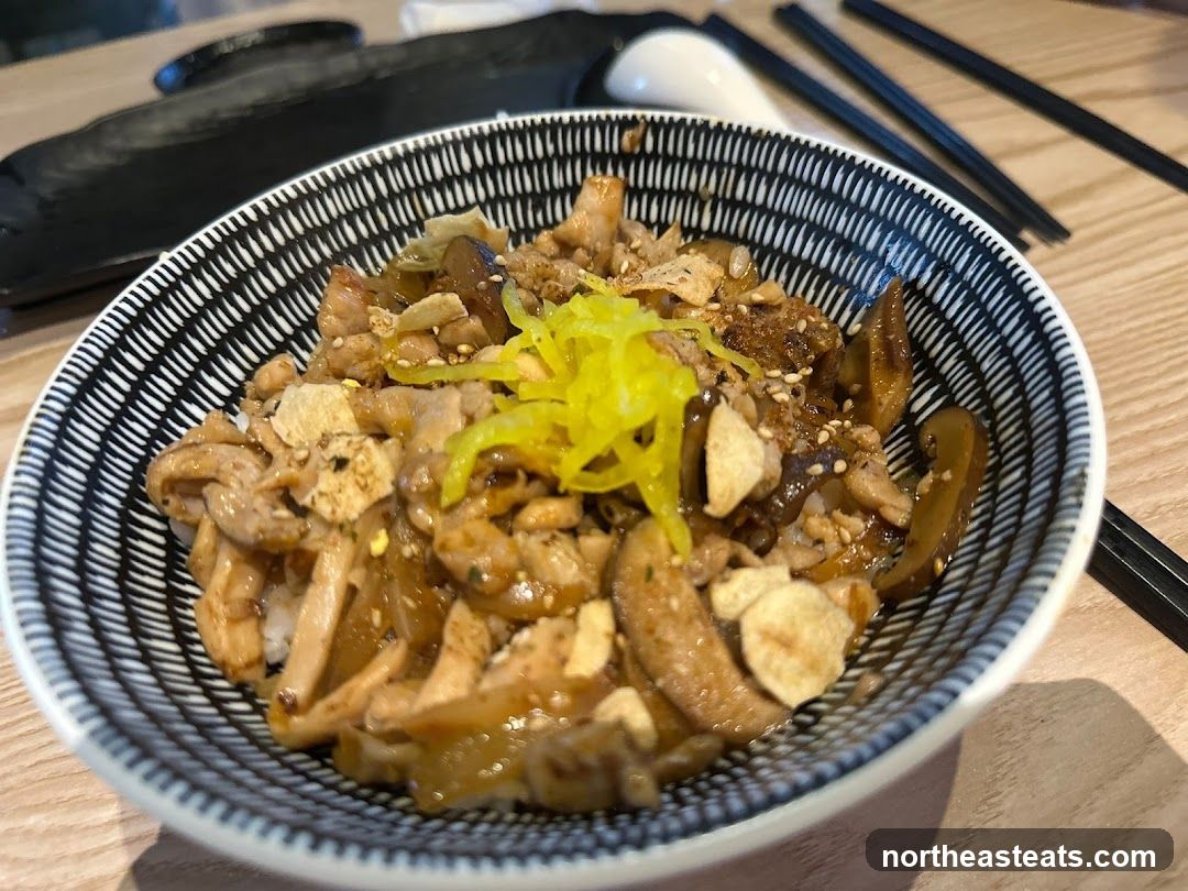 Bowl of food with mushrooms and meat