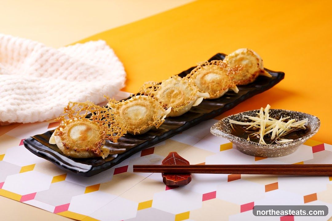 Pan-fried dumplings with crispy lace and dipping sauce