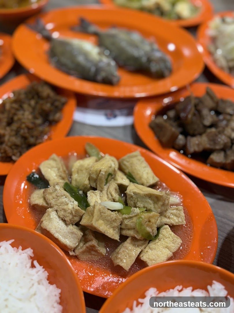Various dishes served on orange plates