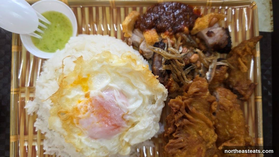 Rice dish with fried egg and crispy pork