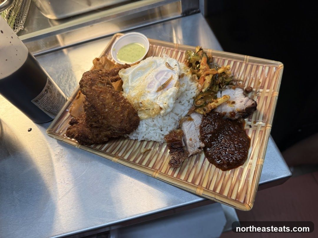 Rice dish with fried chicken and pork