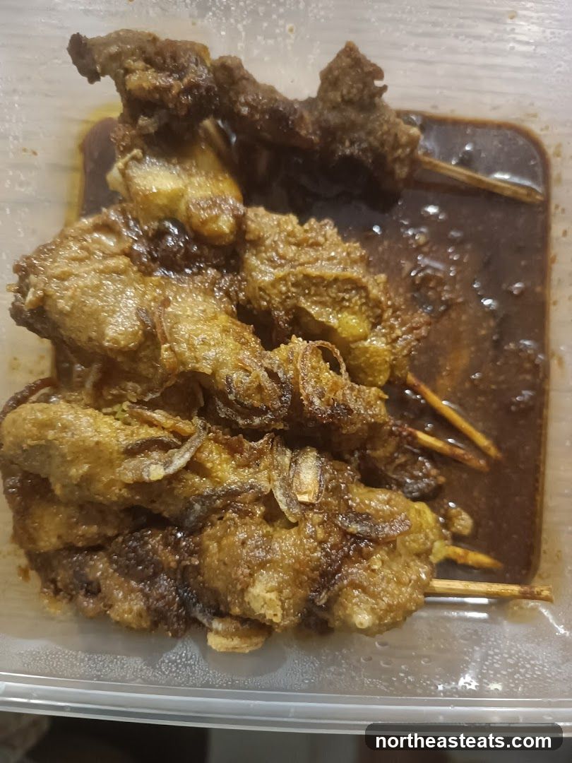 Meat skewers in sauce