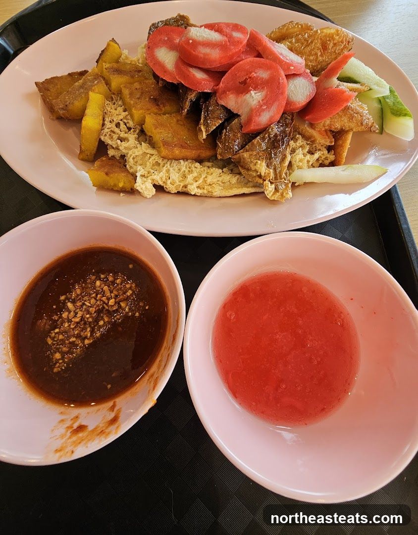 Plate of food with dipping sauces
