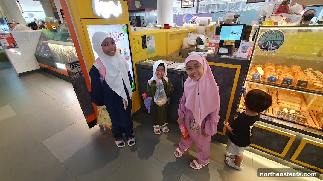 Children at a bakery counter