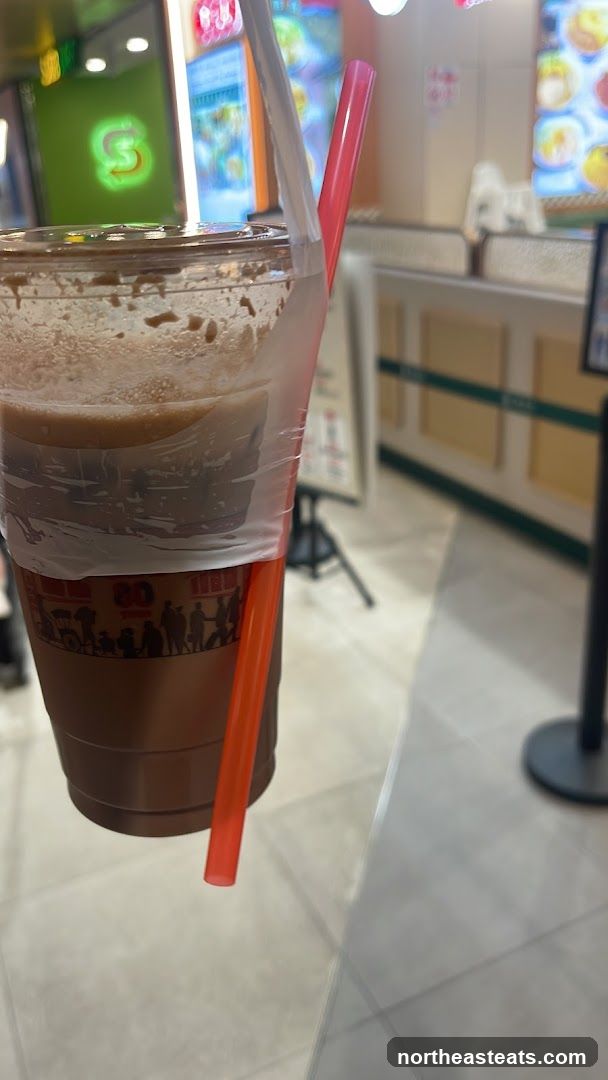Beverage in a cup with straws