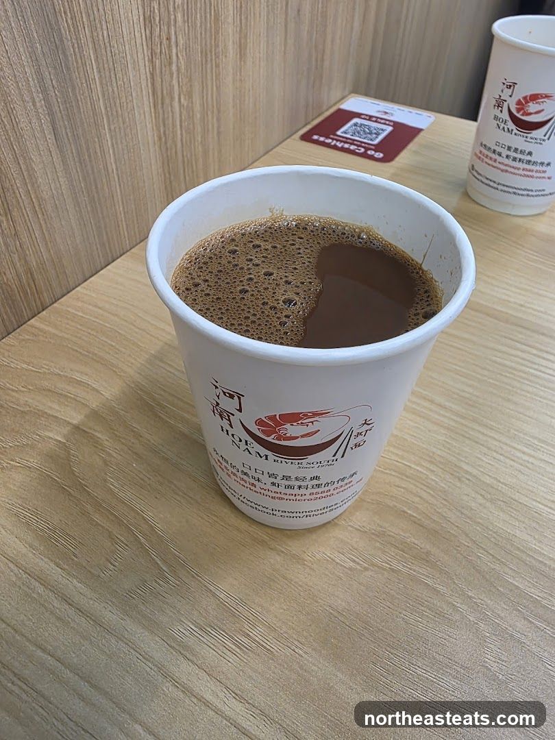 Beverage in a branded cup