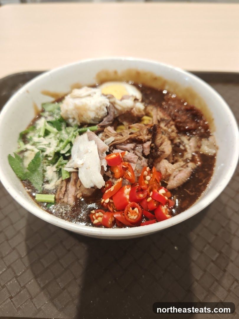 Bowl of noodles with meat and chili