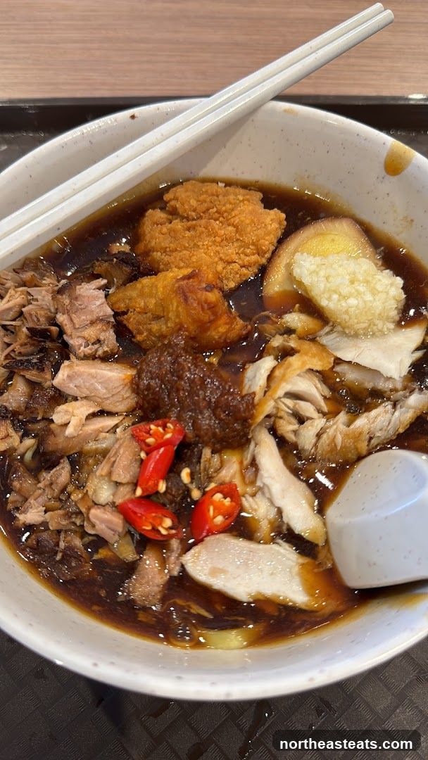 Bowl of noodles with various toppings