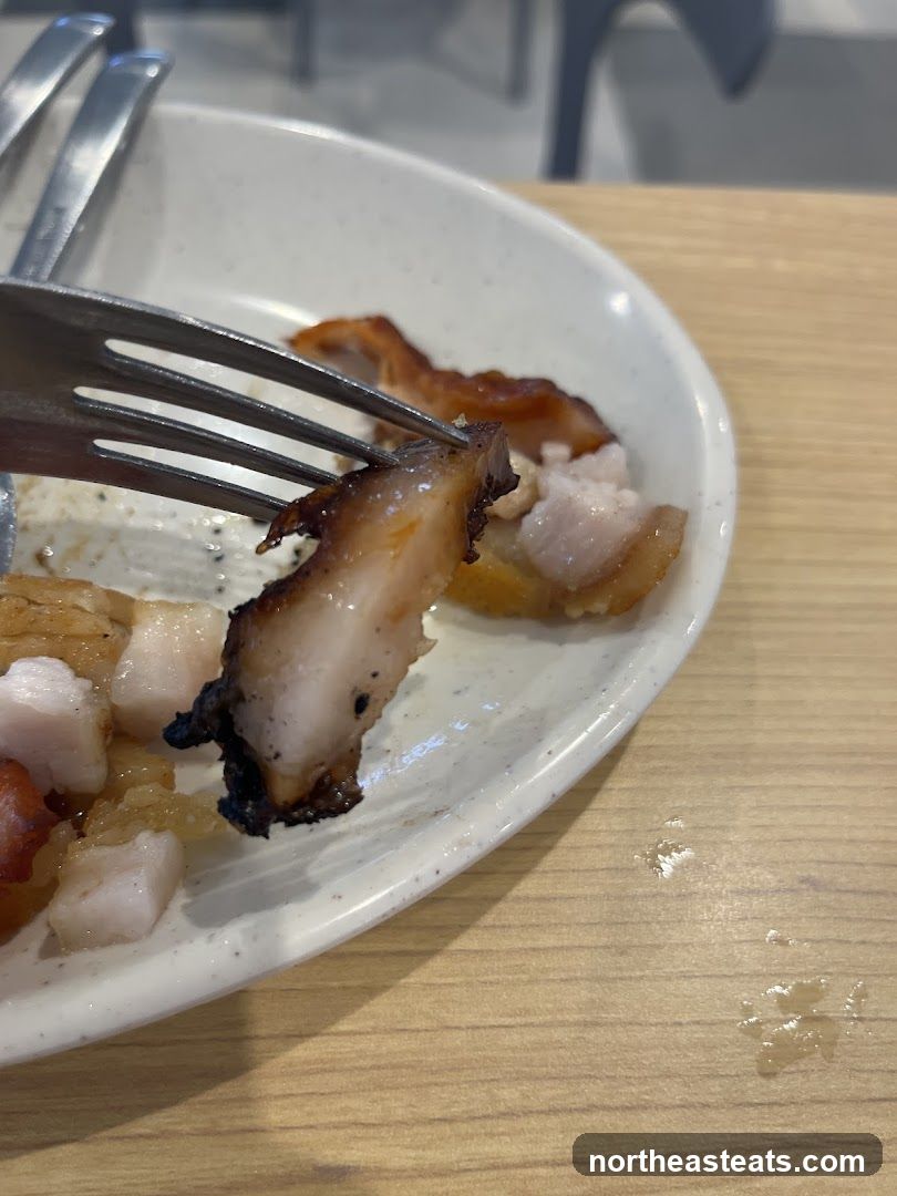 Close-up of Roasted Pork Belly on a Fork