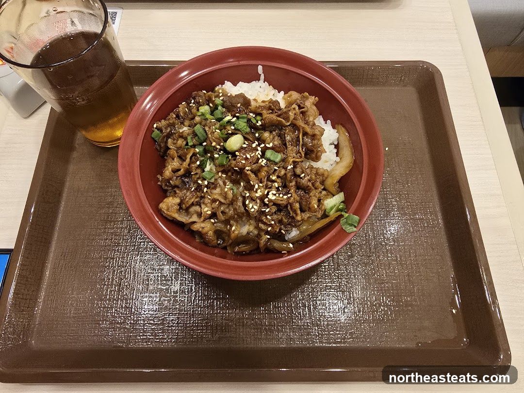 Beef bowl with rice and a drink