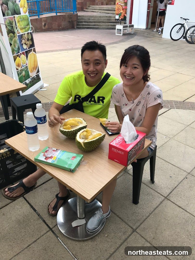 Couple eating durian