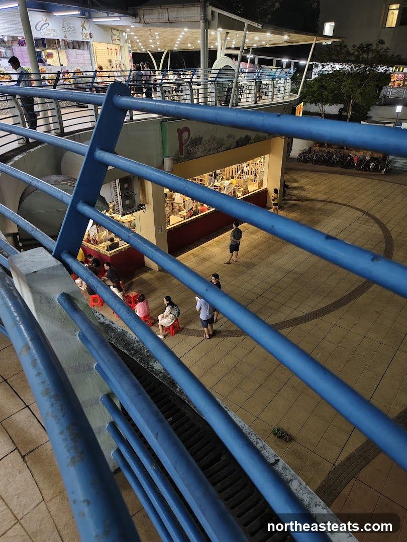 Outdoor seating area with shops